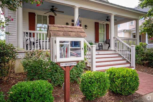 Pick a book from the free library stand in Hammond's Ferry.