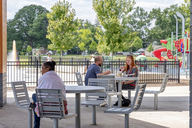 Parents and grandparents watch the children play at Linden Park & Community Center.