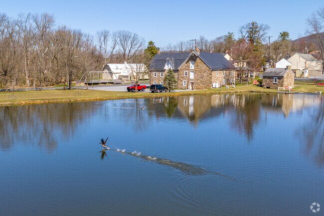 Locals can see the historic grist mill in Hellertown from across Sunfish Pond.