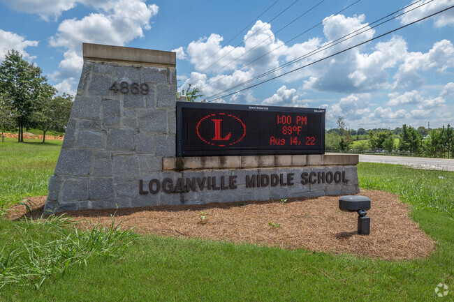 Loganville Middle School signage displays school news.