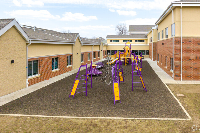 A tucked away playground at McGrath Elementary keeps the kids contained and safe.