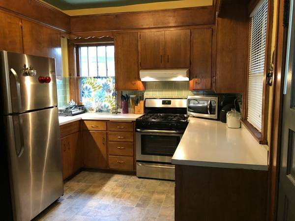 Charming vintage kitchen with newer appliances, including dishwasher.