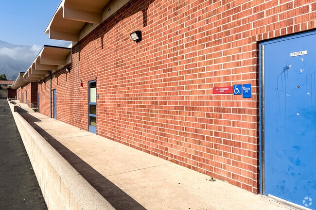Alta Loma Junior High School has warm red brick classrooms.