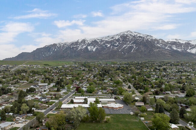 An aerial view of Pleasant View with majestic mountains in the background in Pleasant View.