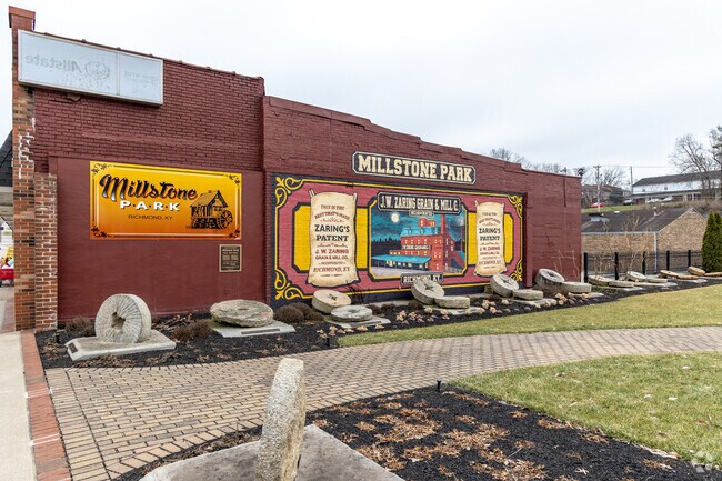 Scarlet begonias line the walkway at Millstone Park during summer months in Richmond.