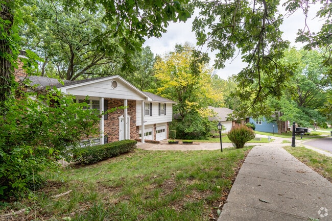 The hilly streets of Southwest Hills are lined with many styles of homes.