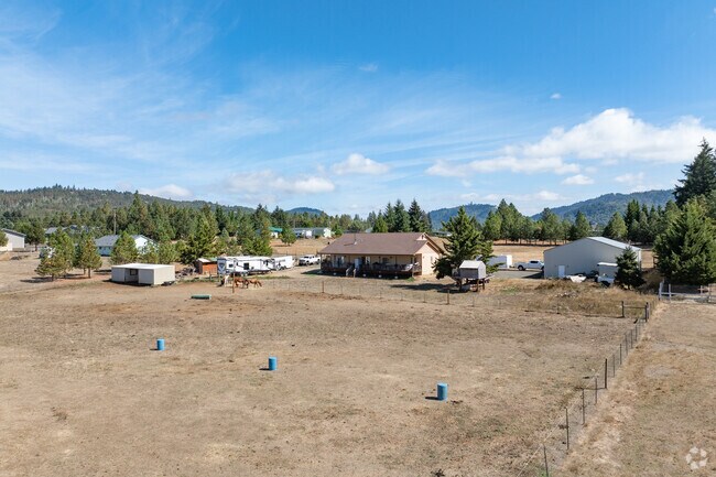 Horses roam in back yards where families train them around barrels in Lookingglass.