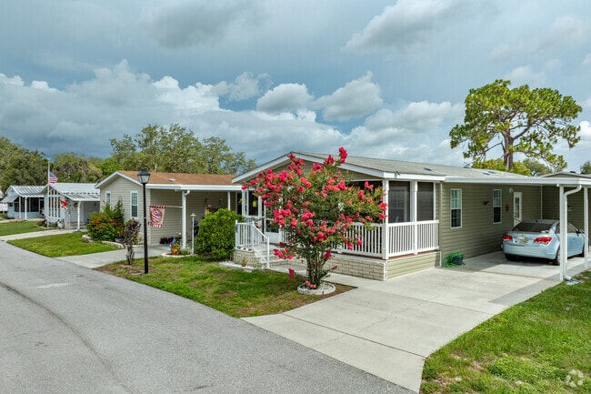 Ranch-style manufactured homes with porches line Zephyrhills South streets.