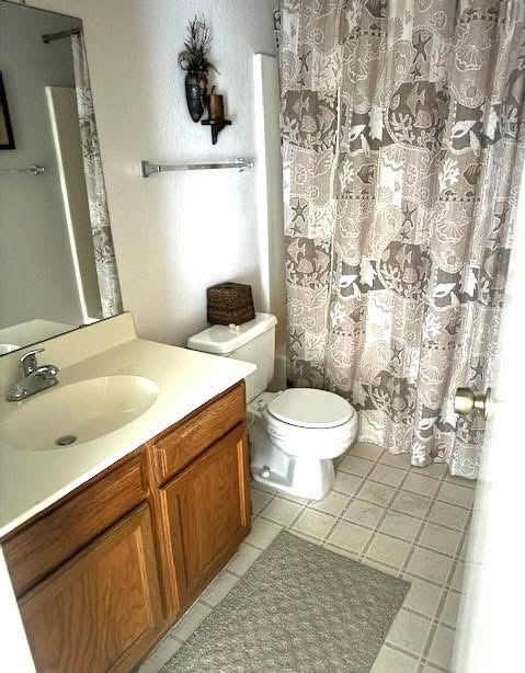 Bathroom near condo kitchen and 2nd bedroom.