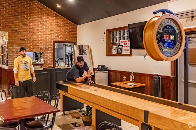 Play some shuffleboard at the Ormsby Avenue Cafe just blocks from Arlington.