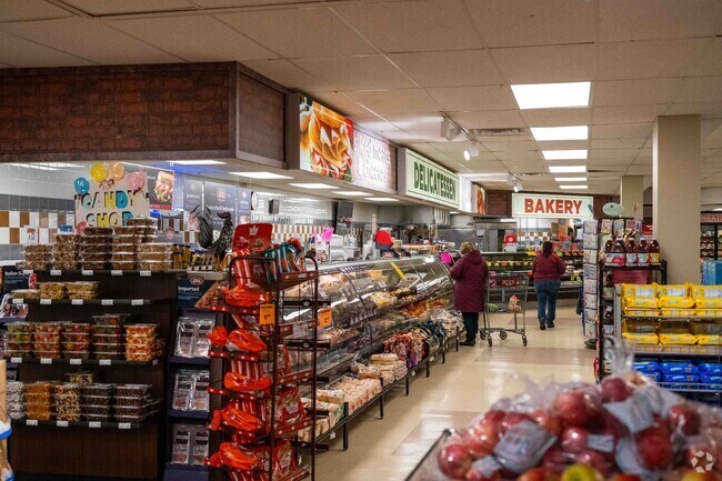 People enjoying their shopping in Berkot’s Super Foods grocery store in Braidwood, IL.