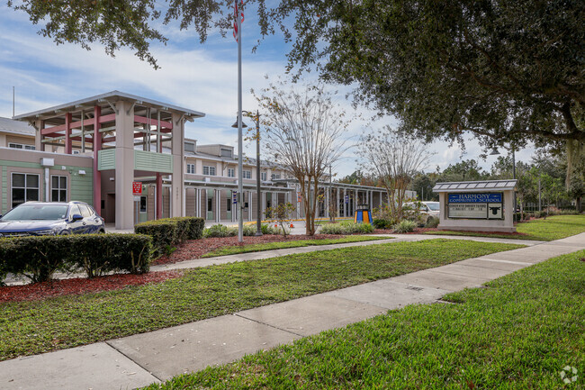 A sidewalk view of Harmony Community School.