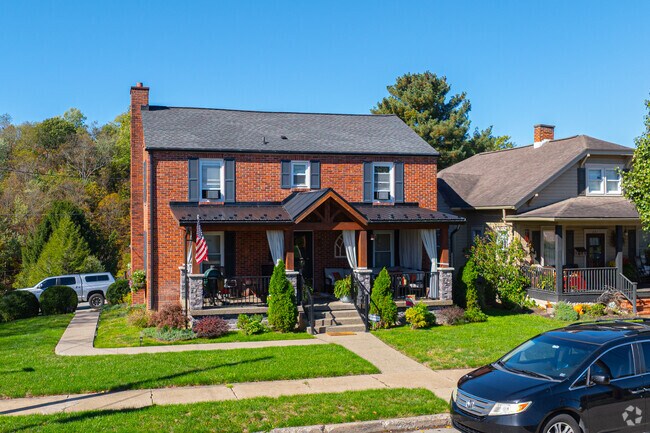 A Colonial Revival home features a welcoming front porch.