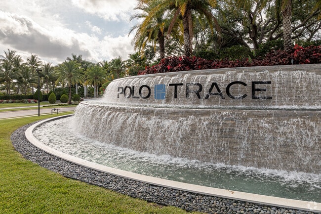 The stunning entrance of Polo Trace warmly invites visitors to enjoy the beauty of luxury living.