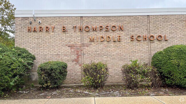 Harry B. Thompson is in Syosset