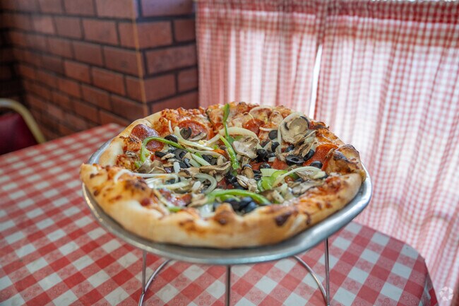 Enjoy a delicious pizza from Carpenetti's Pizza in Moody.