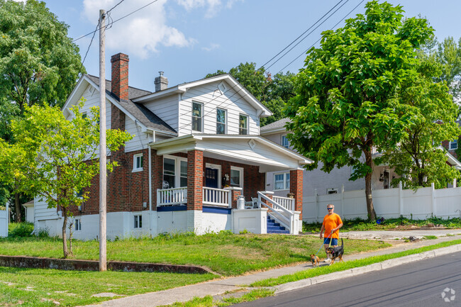 Bungalows can be seen in Shenandoah West along with neighbors taking their dogs for walks.