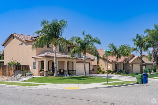 Spanish style inspired homes with palm trees in Wasco.