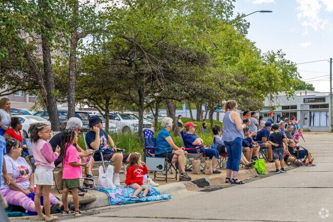 Residents of Rockford eagerly await the Rockford Labor Day Parade.