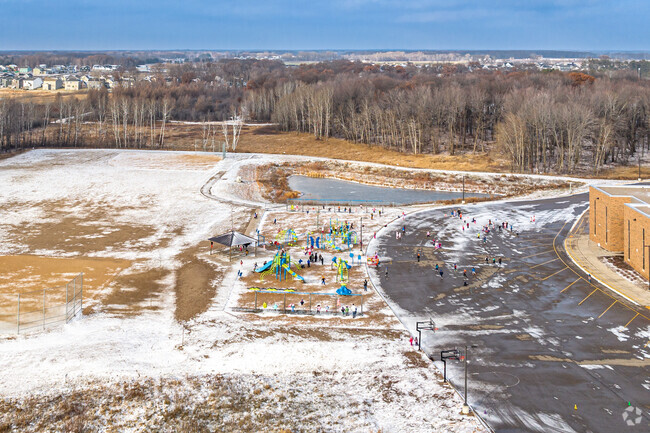 Sunrise Elementary School is located on a large piece of land surrounded by trees and wetlands.