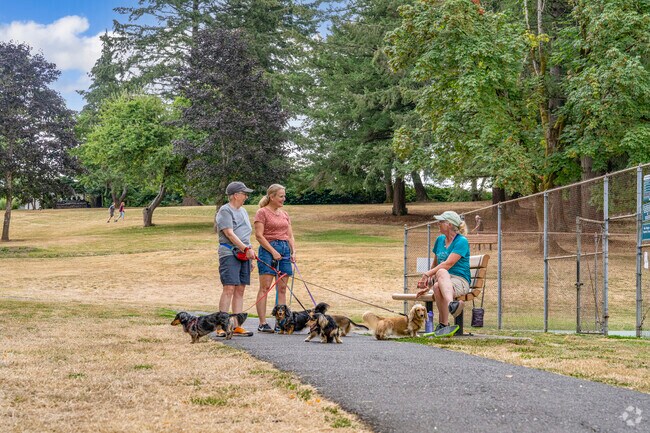 Raleigh Park in Raleigh Hills offers open green spaces and walking paths perfect for dog owners and outdoor activities.