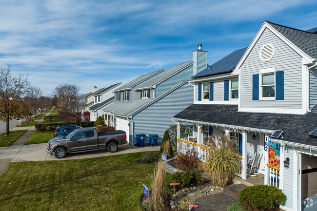 A row of traditional homes in Amherst shows the neighborhood's charm.