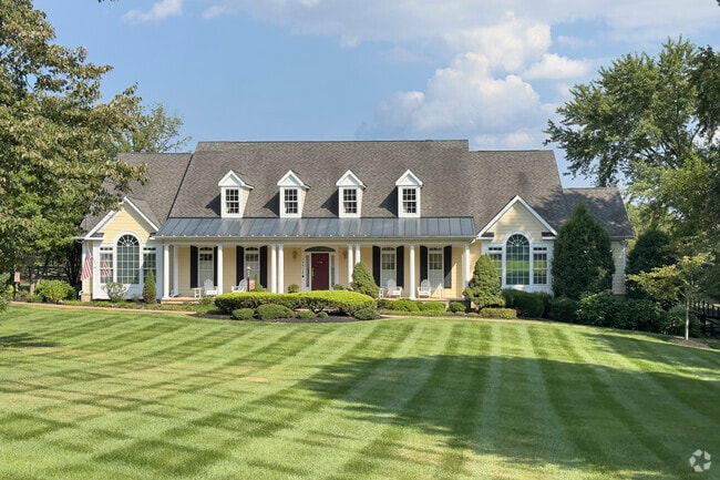 Cape Cod homes in Hickory Grove offer large yards and timeless charm in a quiet country setting.
