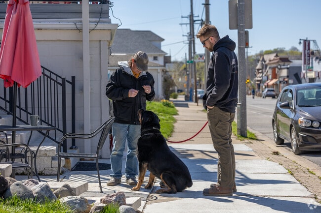 A good dog earns its treat on the quaint streets of Hawthorne Glen.