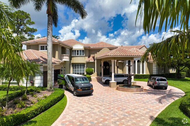 A multi-level mediterranean home with a large driveway in the Breakers West neighborhood.