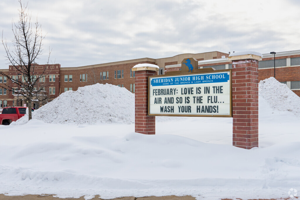 A large marquee at Sheridan Junior High School informs parents of events.
