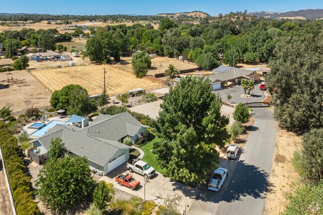 Most of the homes in Garden Farms have large shade trees and room for a pool.