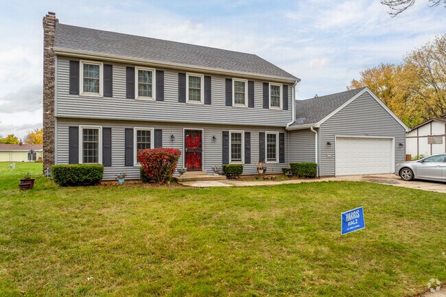 A single family colonial style home stands proudly in Halyard Park.