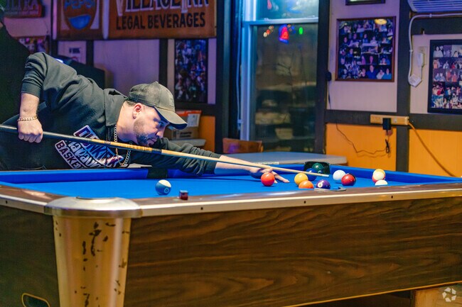 Locals and visitors gather at Village Inn, Hanover's only bar, for a weekly billiards league.
