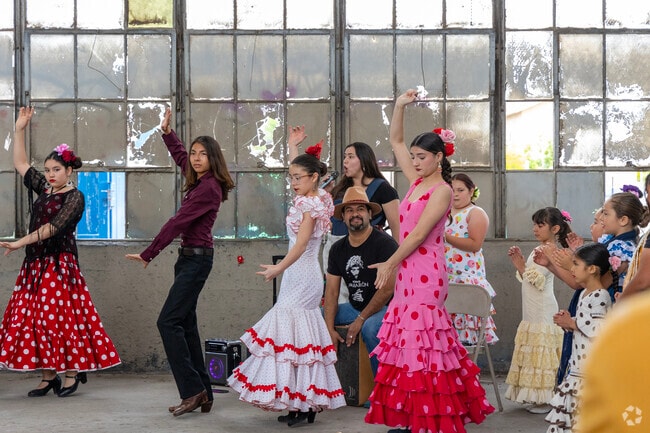 Young Spanish dancers entertain an audience on the first day back at The Rail Yards Market.