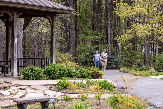 A couple takes a walk along the tranquil paths of South Arkansas Arboretum in El Dorado.