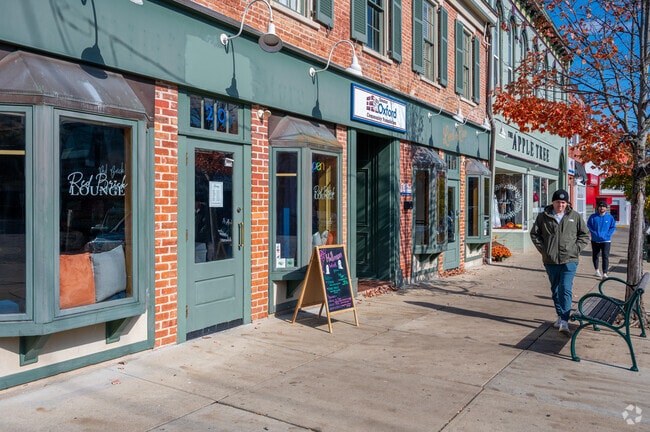 The city of Oxford features historic buildings housing many different shops and restaurants.