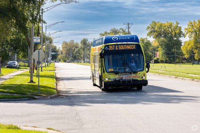 Catch the Pace Bus #357 right on Woodlawn Avenue that dissects Ford Heights, IL.