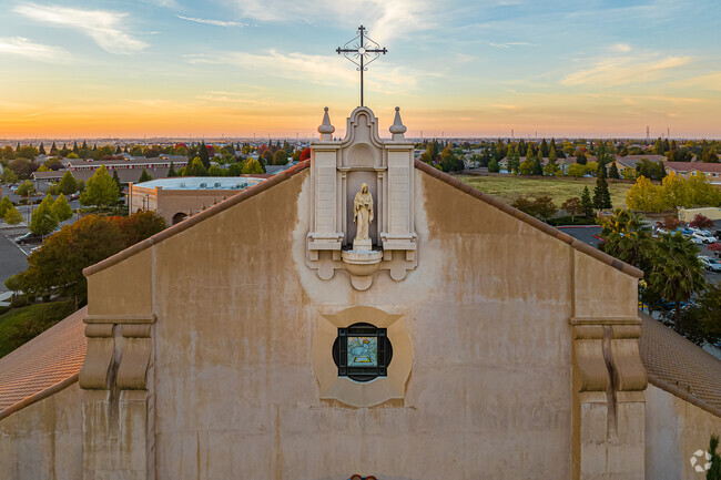 Beautiful architecture accentuated by sunset at St. Clare Catholic Church in Junction West.