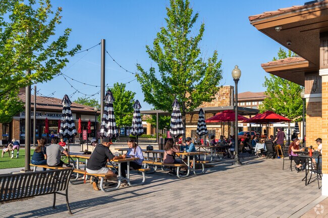 Arrowhead residents enjoy a warm afternoon at the patio of 302 South.