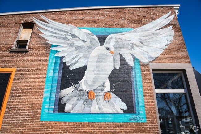 Sacred Grounds Coffee in Wabash dons this beautiful mural of a white dove on its western wall.