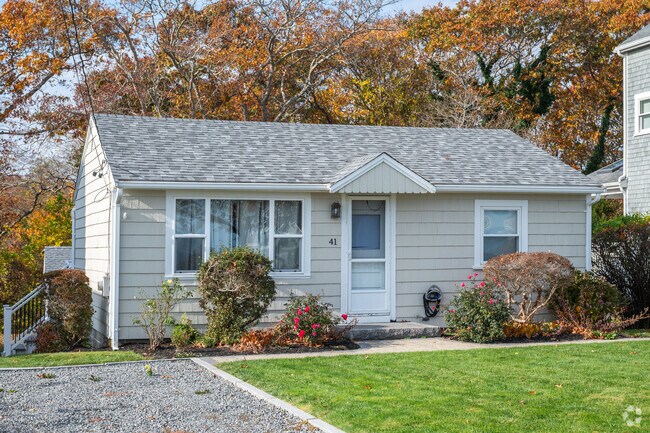 Cozy beach cottages line the shores along Plymouth Bay.