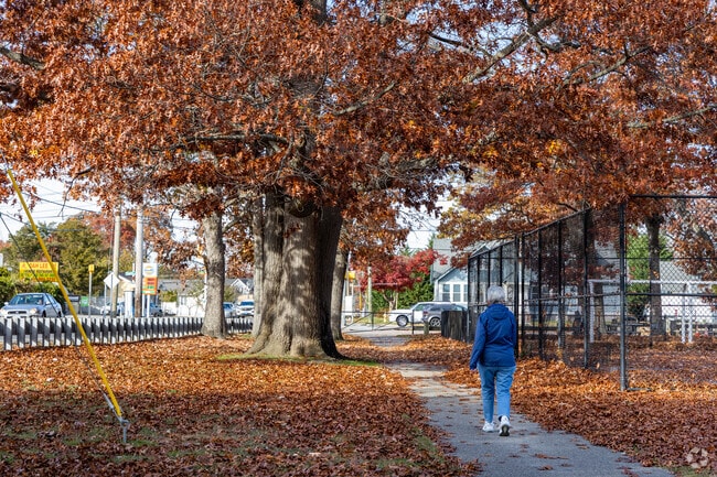 Stroll through the scenic walking path in Waltess Estates Park.