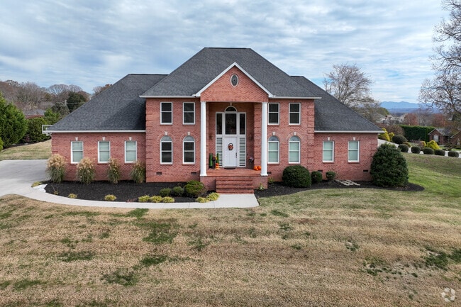This grand home in Alcoa offers a large yard and beautiful curb appeal from a street view.