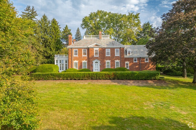 Grand colonial revivals sit on large lots with plenty of room for kids or pets in Holmes-Foster.