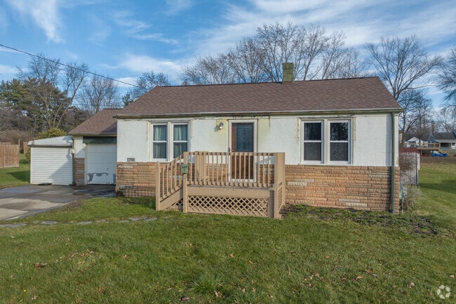 Ranch style home with a tidy lawn in Churchill.
