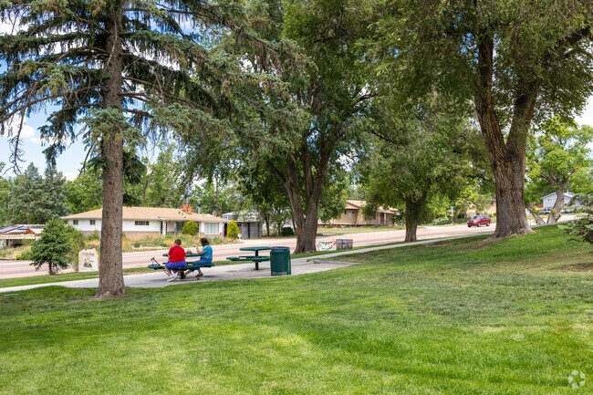 Sit back under the shade of the large trees in Pi-Ute Park.