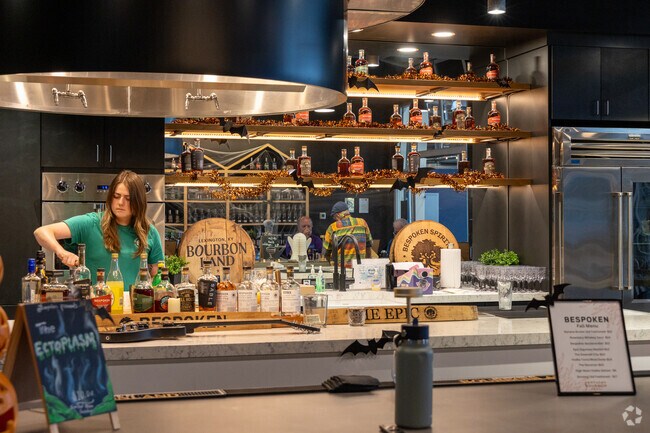 Bourbon lovers in Radcliffe-Elkhorn Park enjoy happy hour at Bespoken Spirits.