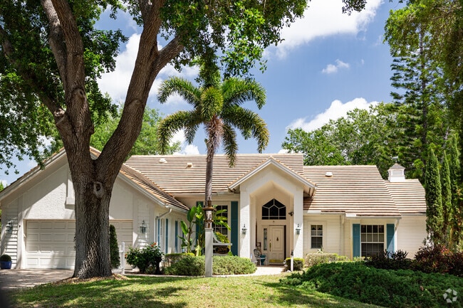 Traditional style homes surrounded by mature trees are common in Villages of Monterey.