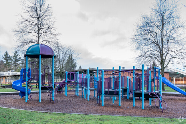 Russell Elementary features a large play structure behind the school.