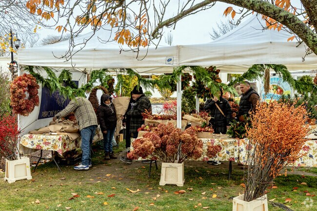 Many vendors setup on the green off Main St. for the  Westhampton Beach Farmers Market.